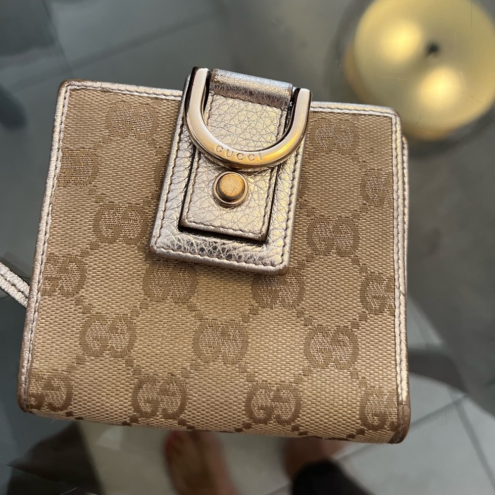 Beautiful authentic Gucci wallet with gold trimming